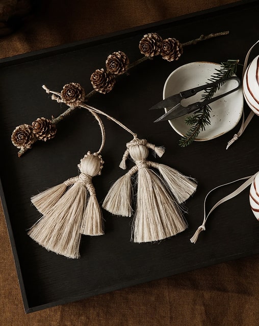 Close up detail of high-quality fabric texture of breast cancer scrubs australia showing the pink ribbon embroidery and durable stitching